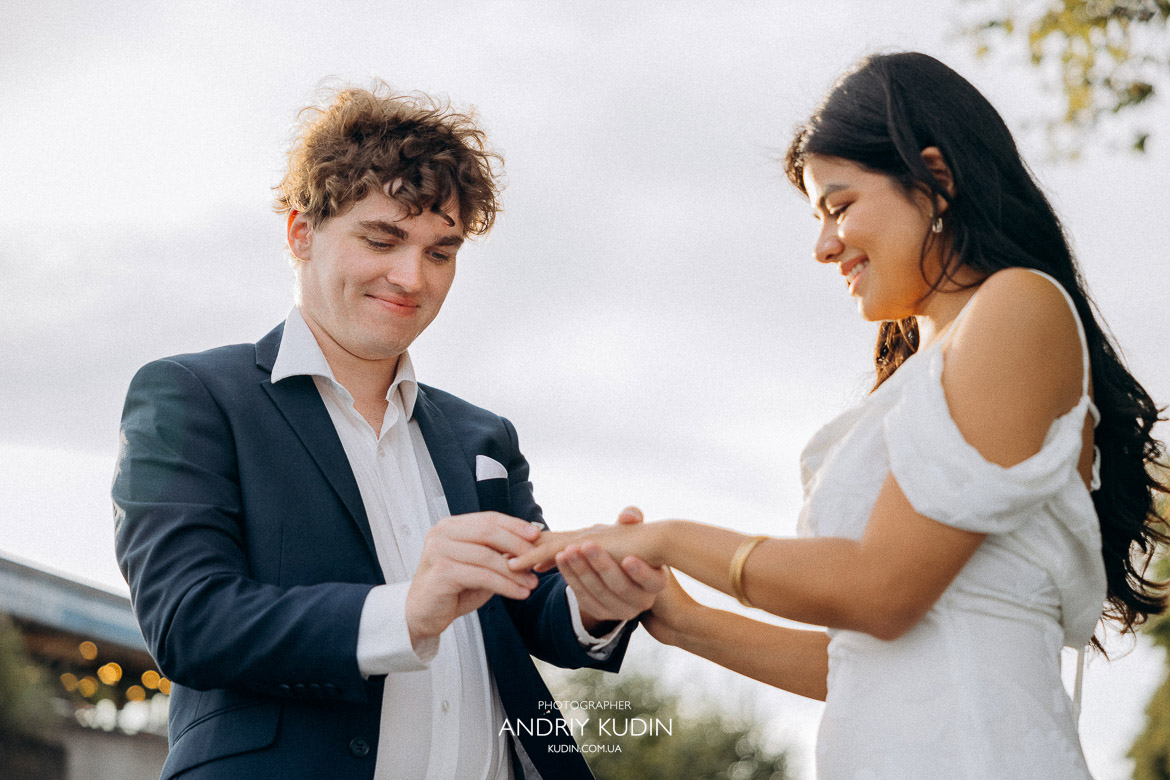Romantic proposal by Lake Zurich with mountains in the background, 