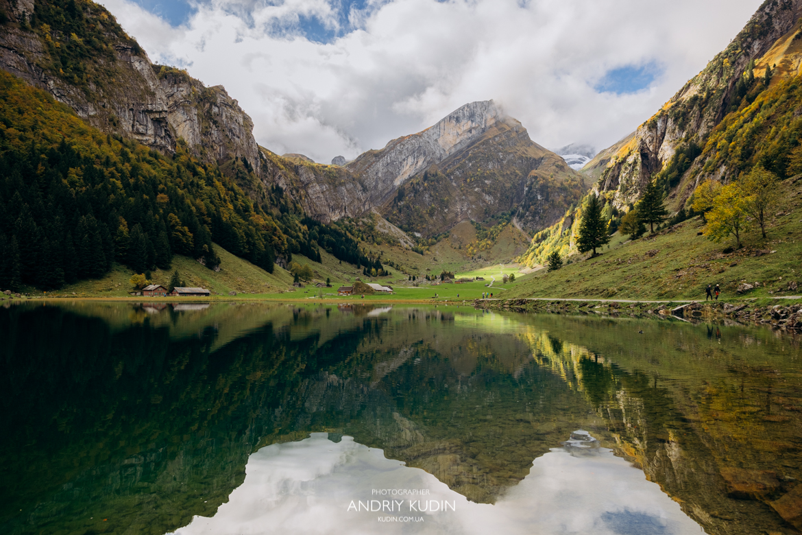 Couple proposing at Seealpsee Switzerland with alpine meadow views