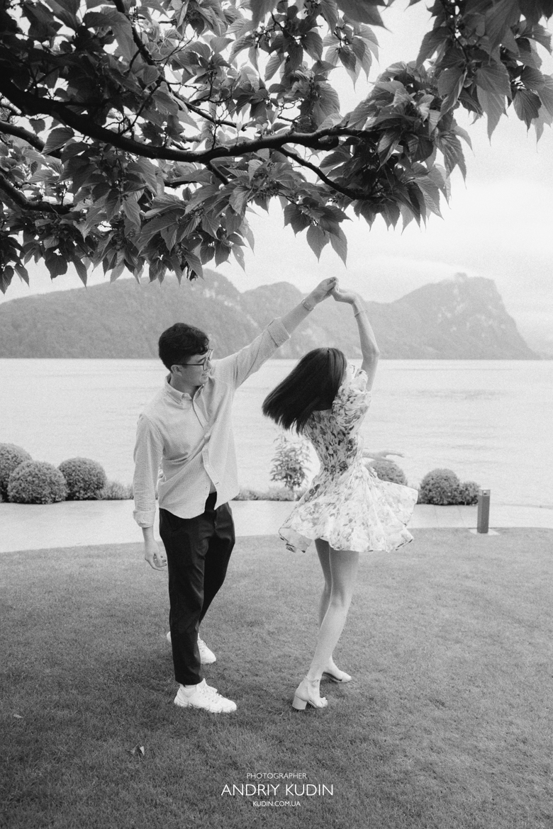 Couple proposing at Park Hotel Vitznau Switzerland with Rigi mountain backdrop