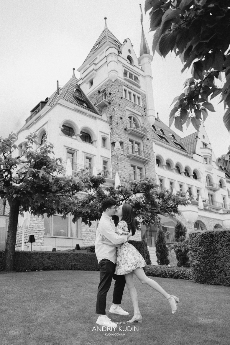 Couple proposing at Park Hotel Vitznau Switzerland with Rigi mountain backdrop