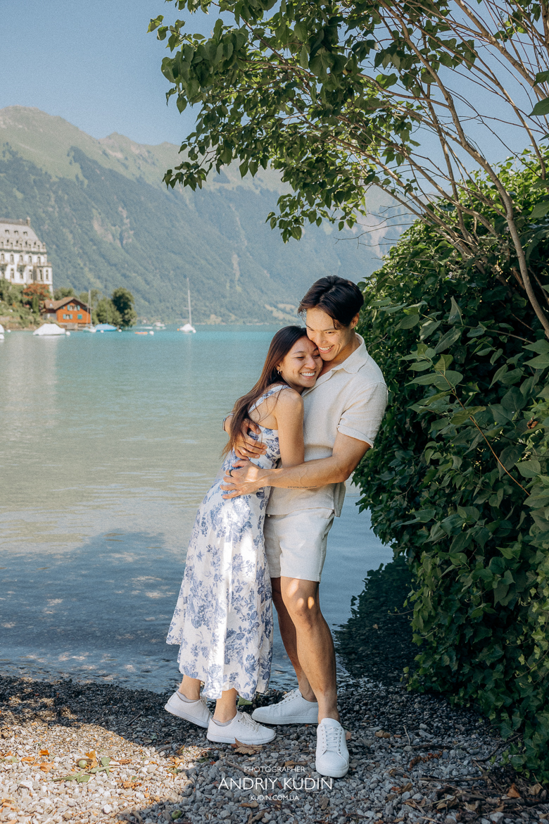 Iseltwald wooden pier proposal with Bernese Alps in background. Marriage proposal photoshoot in Iseltwald, Switzerland. 