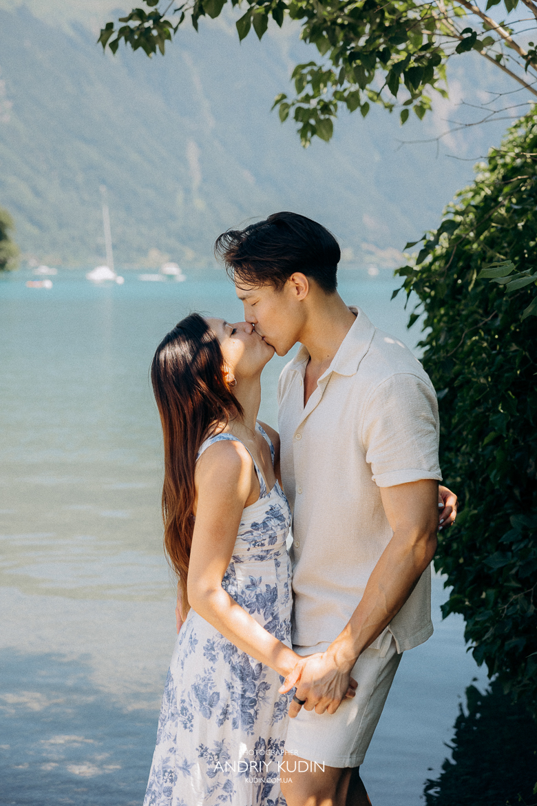 Iseltwald wooden pier proposal with Bernese Alps in background. Marriage proposal photoshoot in Iseltwald, Switzerland. 