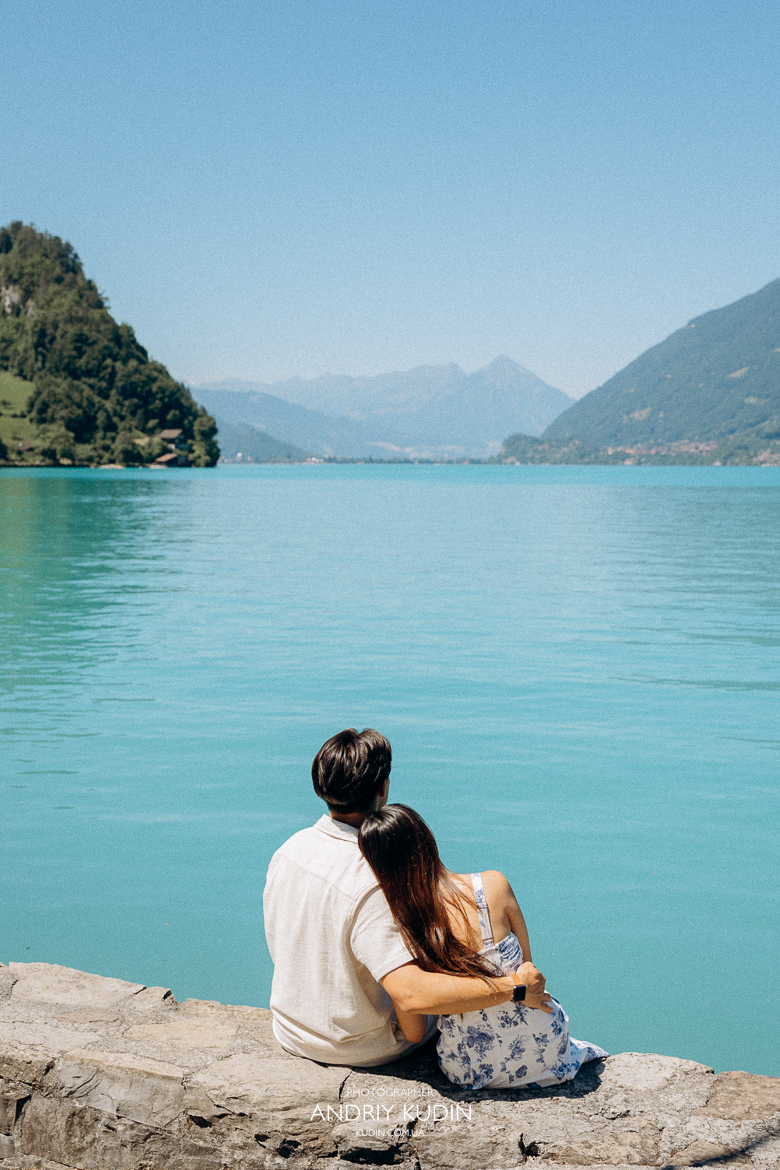 Iseltwald wooden pier proposal with Bernese Alps in background. Marriage proposal photoshoot in Iseltwald, Switzerland. 
