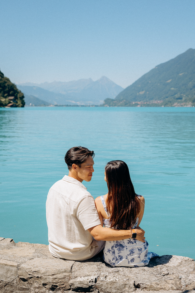 Iseltwald wooden pier proposal with Bernese Alps in background. Marriage proposal photoshoot in Iseltwald, Switzerland. 