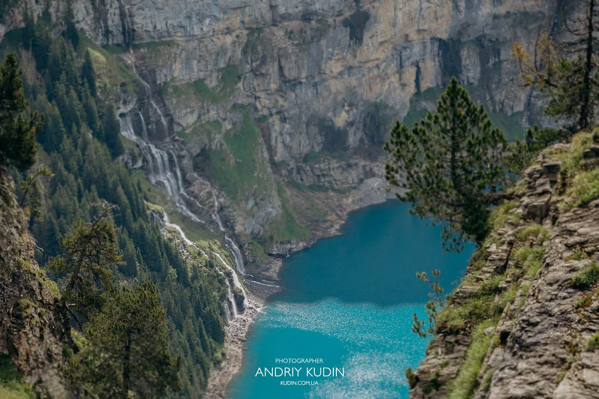 Mountain landscape with waterfalls flowing into Lake Oeschinen Mountain landscape with waterfalls flowing into Lake Oeschinen