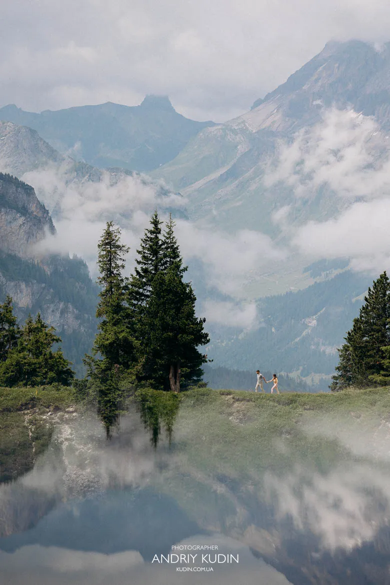 Newly engaged couple exploring the alpine trail above Lake Oeschinen Newly engaged couple exploring the alpine trail above Lake Oeschinen