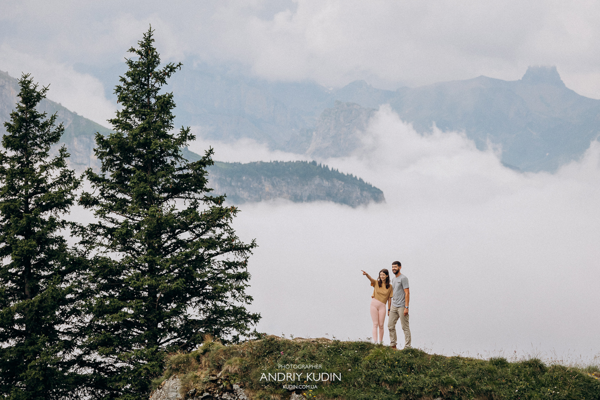 Emotional-proposal-at-Oeschinensee-lookout-with-snow-capped-Alps-background