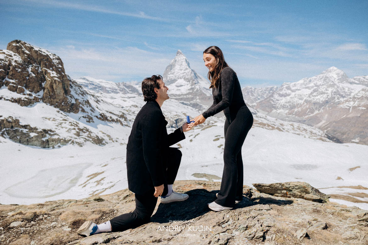 Man kneeling for zermatt proposal in front of Matterhorn peak by switzerland proposal photographer