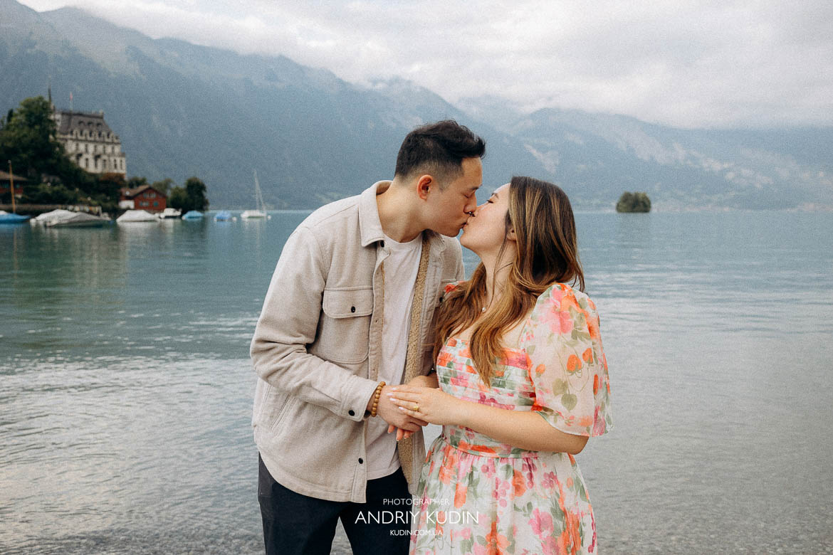 Romantic marriage proposal by Lake Lucerne with Chapel Bridge in background