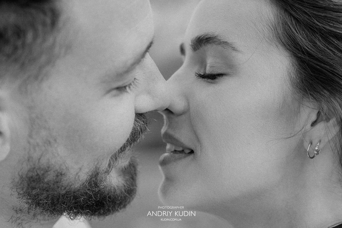 Romantic engagement kiss in Swiss mountains