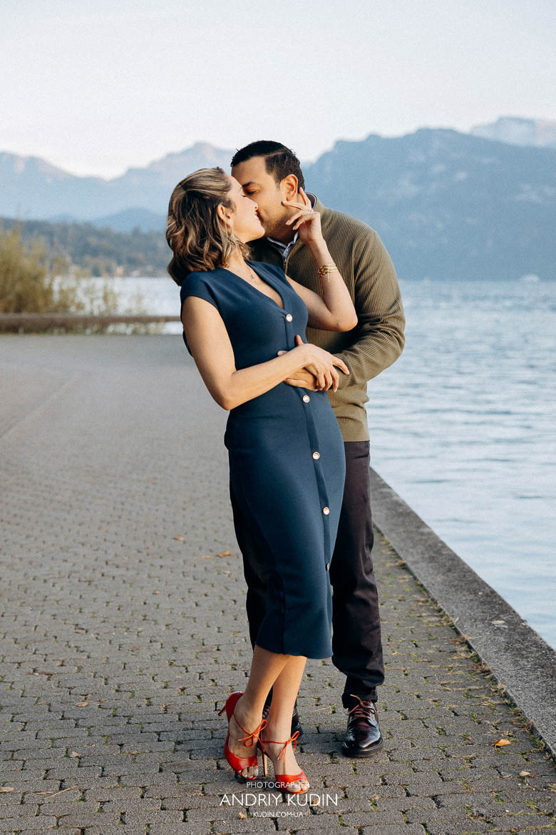 Couple proposing near Lake Zurich with mountains in view