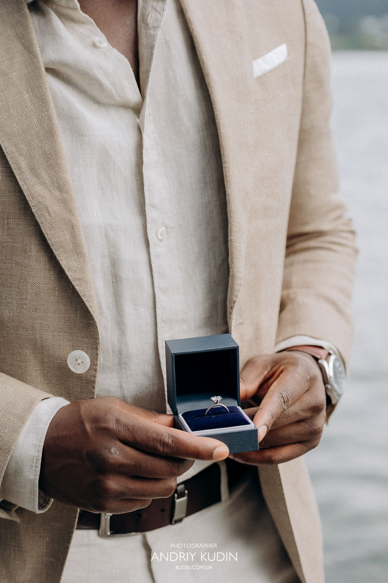 Engagement ring close-up with Lake Zurich in soft focus