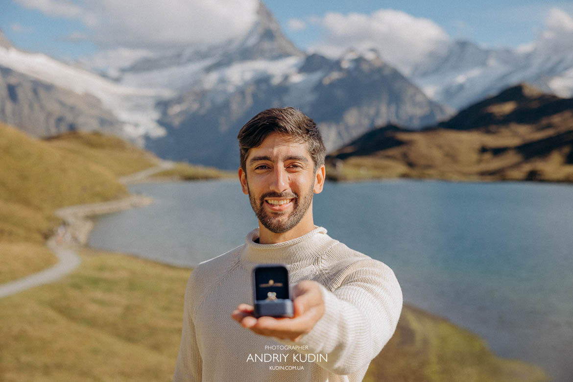 Marriage proposal with snow-covered mountains in Interlaken.