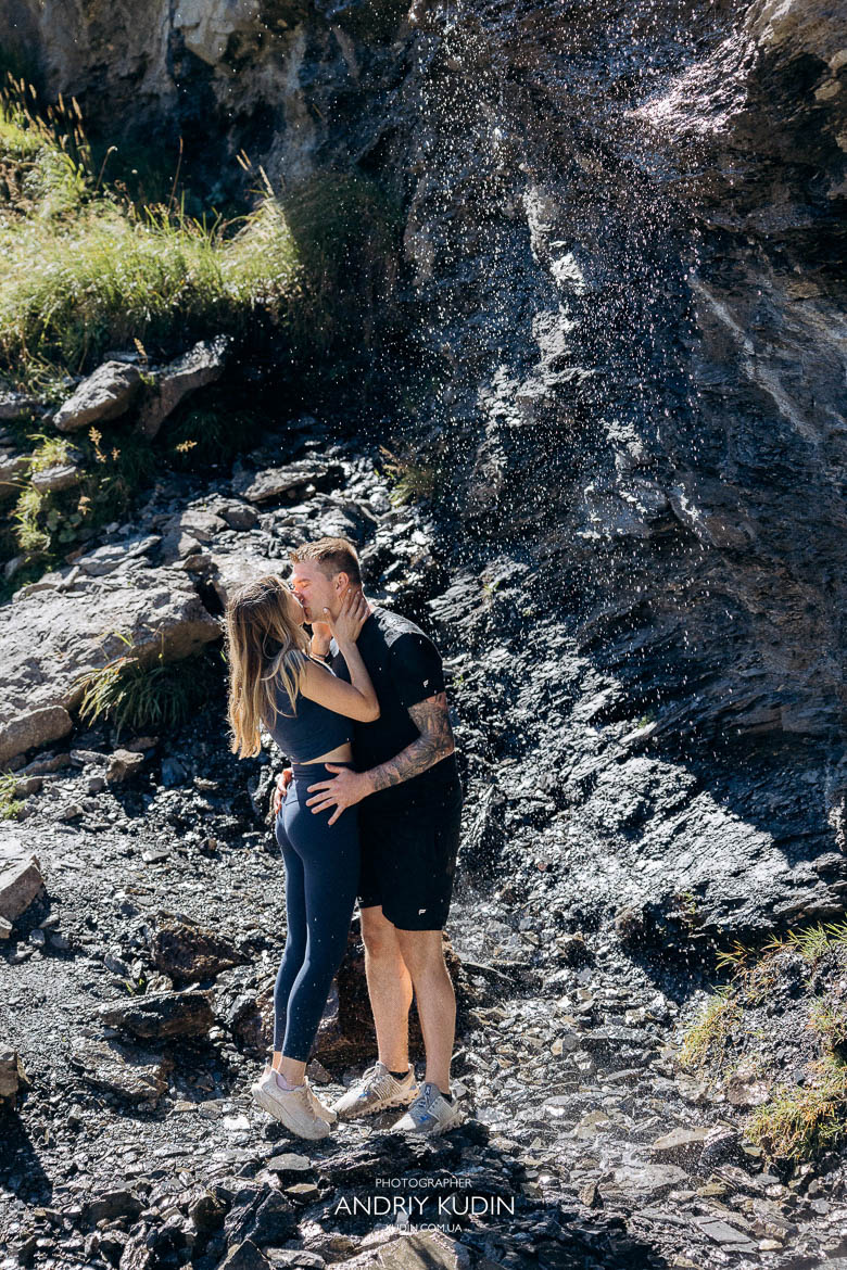 Emotional proposal photography at Lake Oeschinen where he gifts her a Tiffany ring by the Swiss Alps.