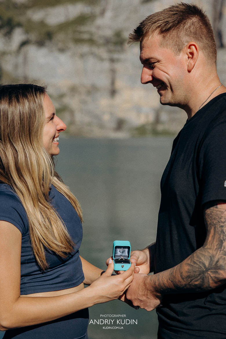 Beautiful Swiss Alps proposal where he gifts her a Tiffany ring overlooking Lake Oeschinen.