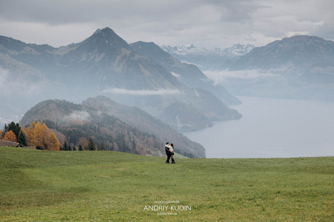 Couple celebrating engagement by Lake Lucerne waterfront