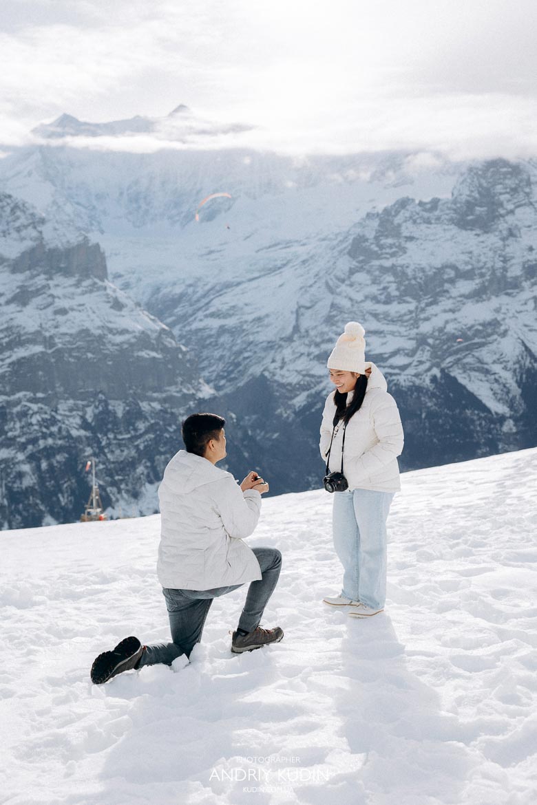 Romantic proposal in Grindelwald surrounded by snowy alpine peaks