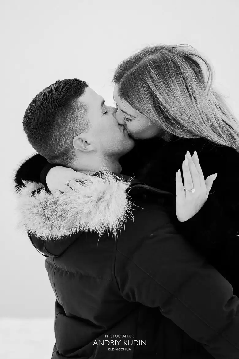 Alpine proposal photos with snowy mountains and dramatic fog