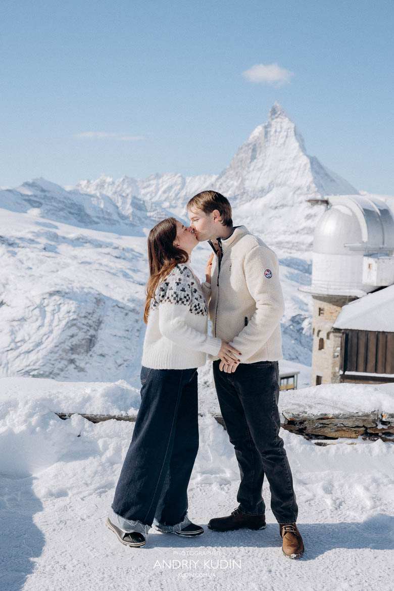 Couple hugging after a successful marriage proposal in Zermatt.