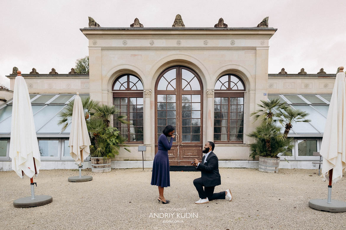 Emotional proposal moment in Switzerland with couple surrounded by fall leaves