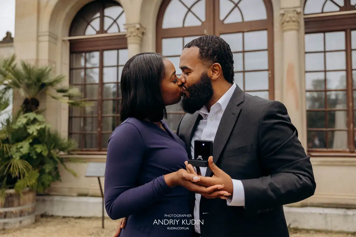 Emotional proposal moment in Switzerland with couple surrounded by fall leaves
