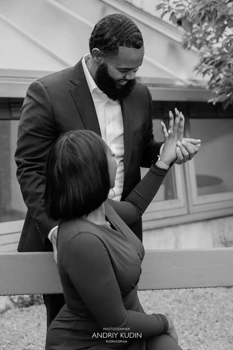 Romantic proposal in Switzerland with engagement ring box and emotional expressions in Zurich park