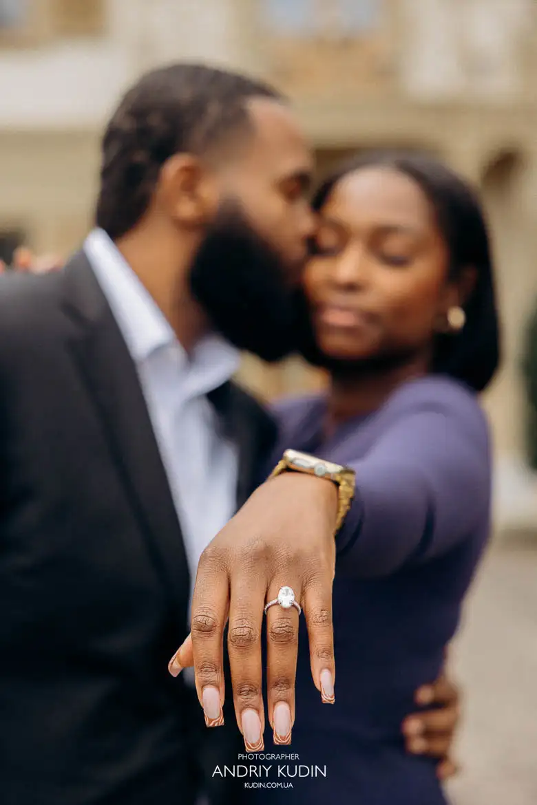 Emotional proposal in Switzerland featuring couple embracing, lifted in arms, with engagement ring visible Emotional proposal in Switzerland featuring couple embracing, lifted in arms, with engagement ring visible