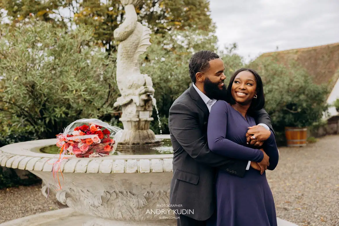 Romantic engagement photoshoot in Zurich capturing couple hugging and looking into each other’s eyes with happiness