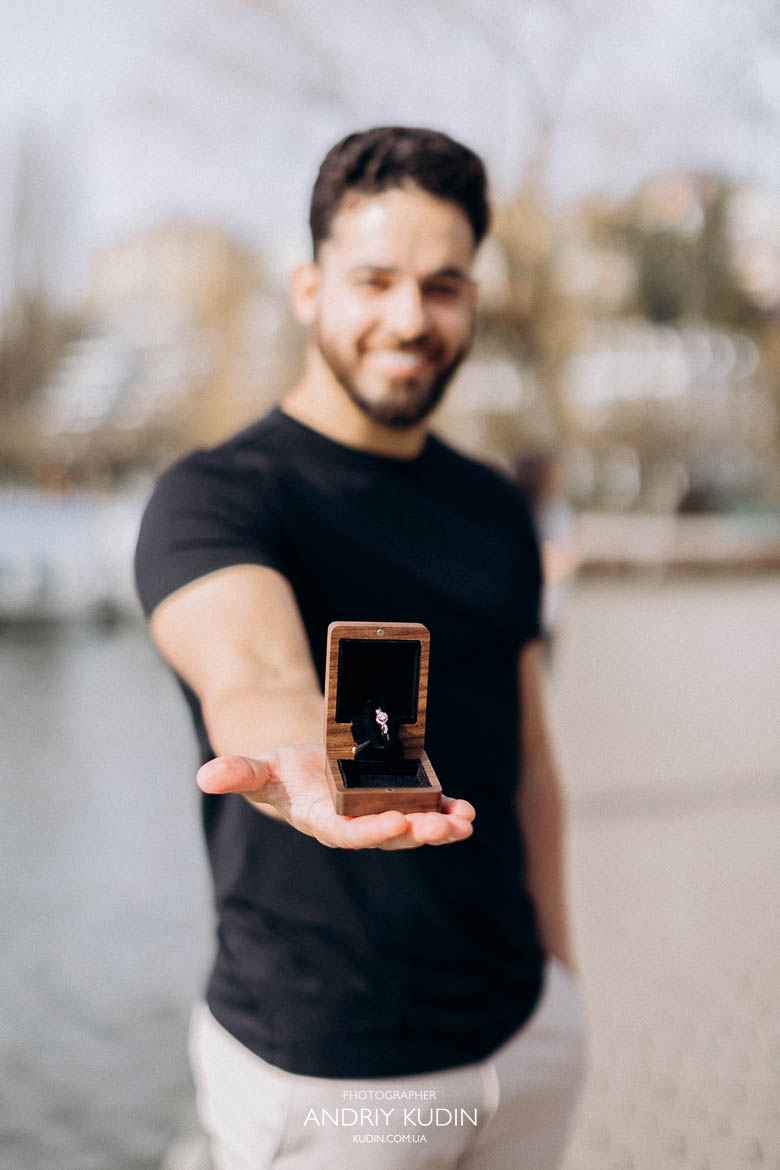 Elegant diamond engagement ring shining in natural light during proposal in Luzern