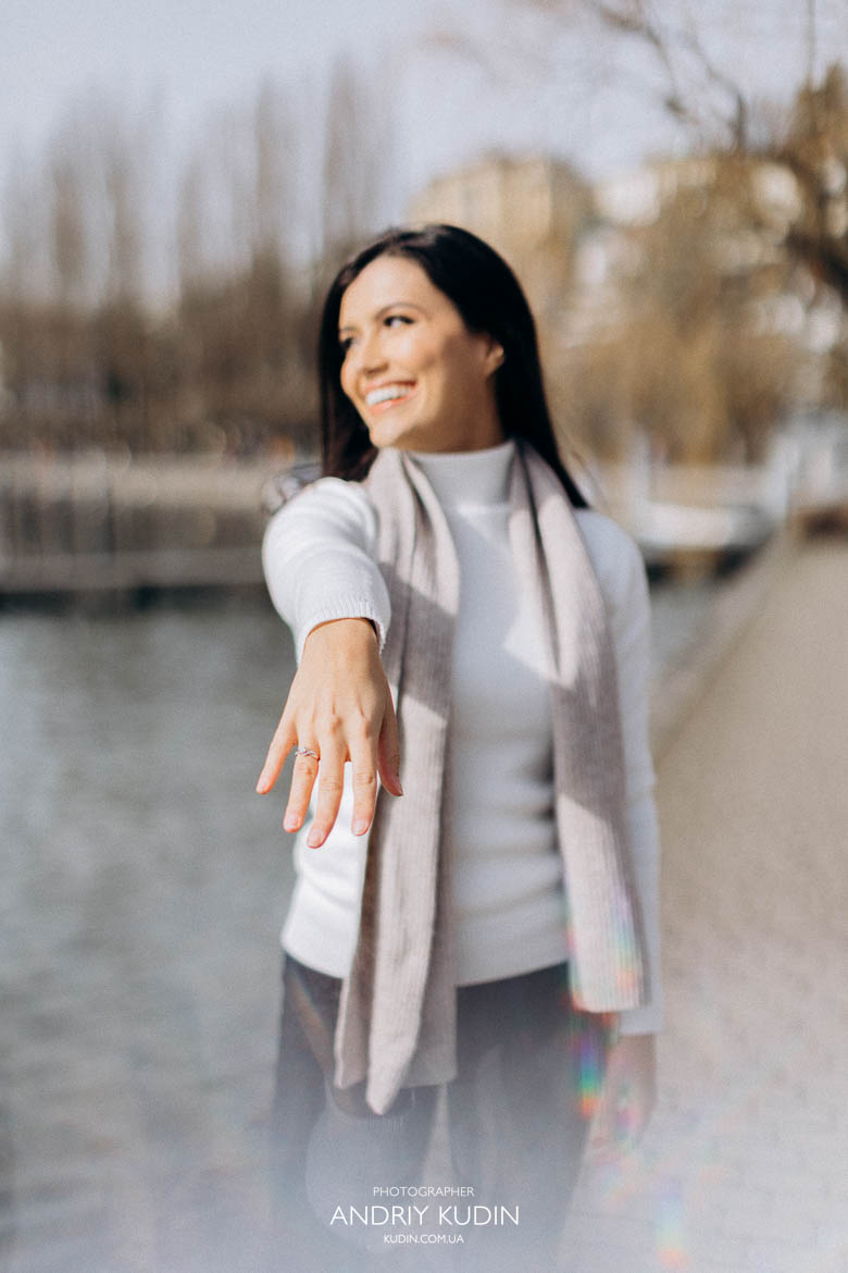 Bride-to-be showing her engagement ring after romantic proposal in Luzern with Lake Lucerne and Swiss Alps behind