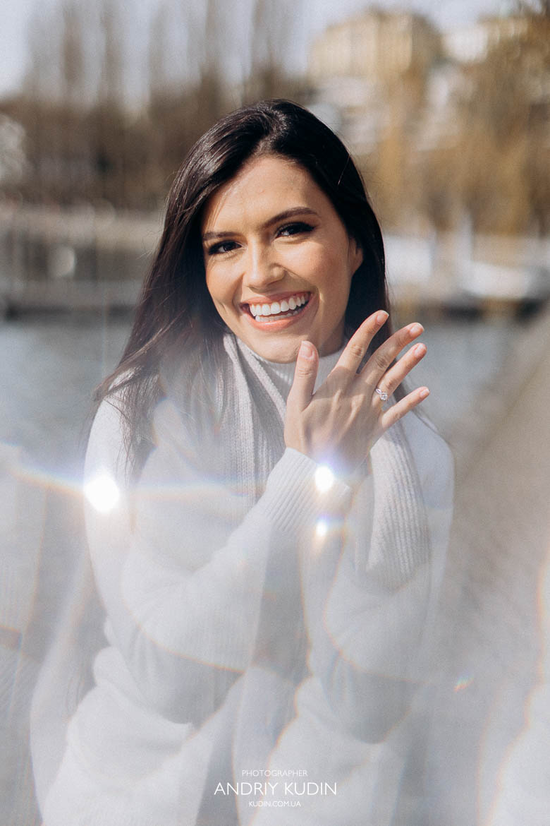 Happy fiancée proudly showing her ring after surprise proposal in Luzern Happy fiancée proudly showing her ring after surprise proposal in Luzern