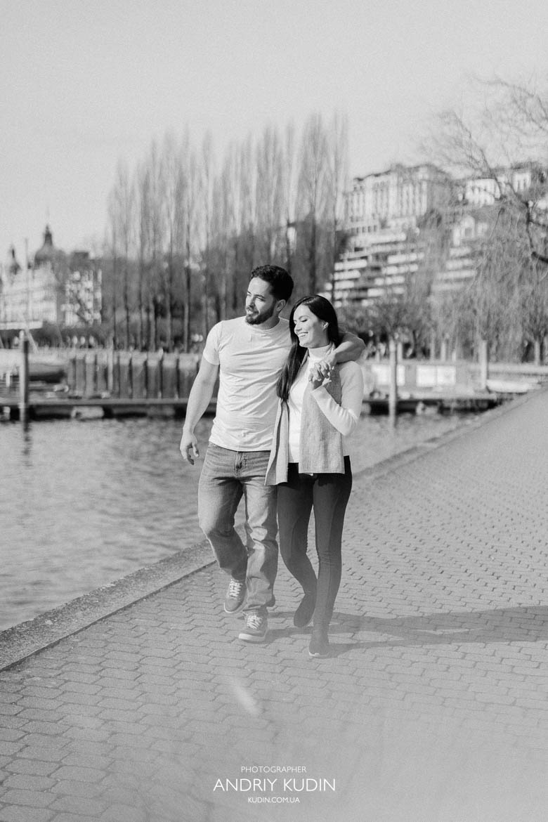 Romantic hug with Lake Lucerne and Alps after proposal in Luzern
