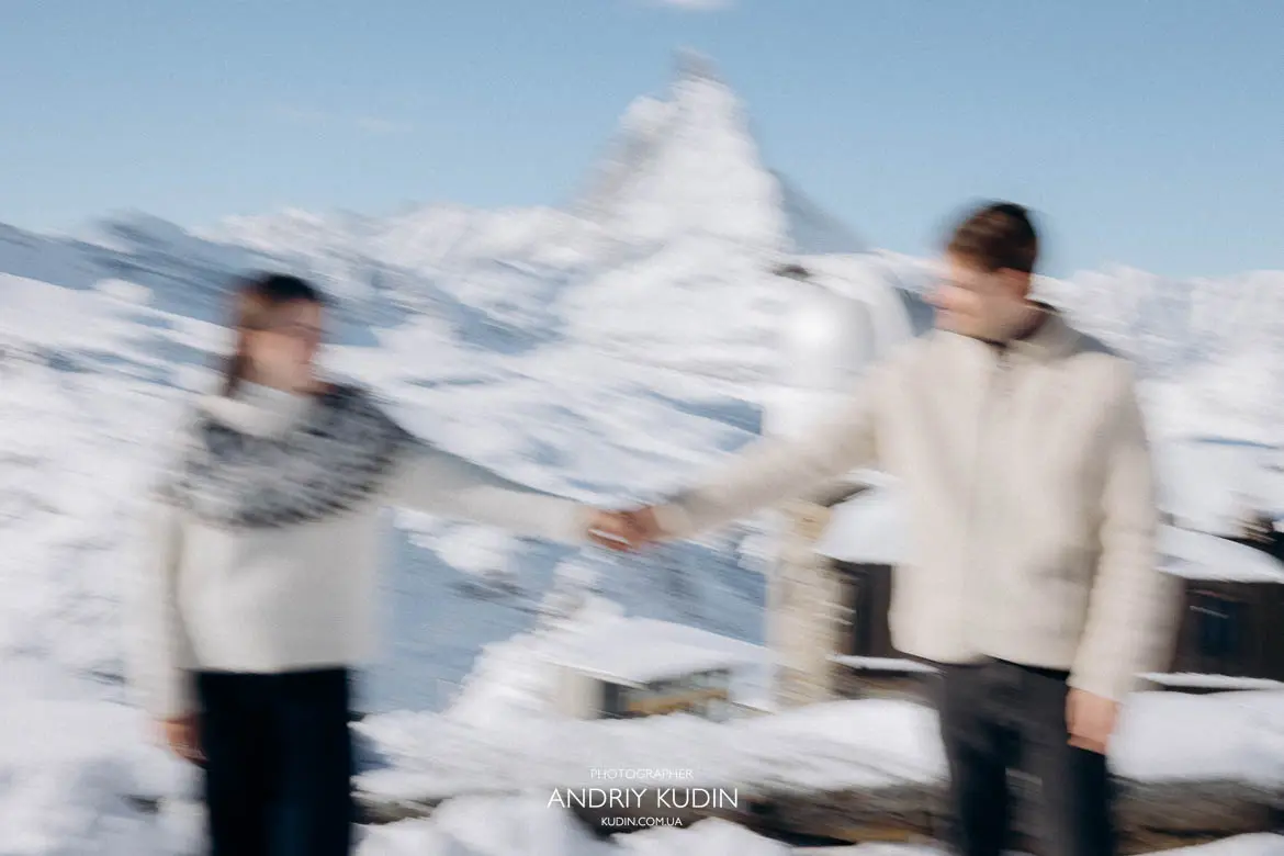 couple-holding-hands-overlooking-matterhorn-glacier
