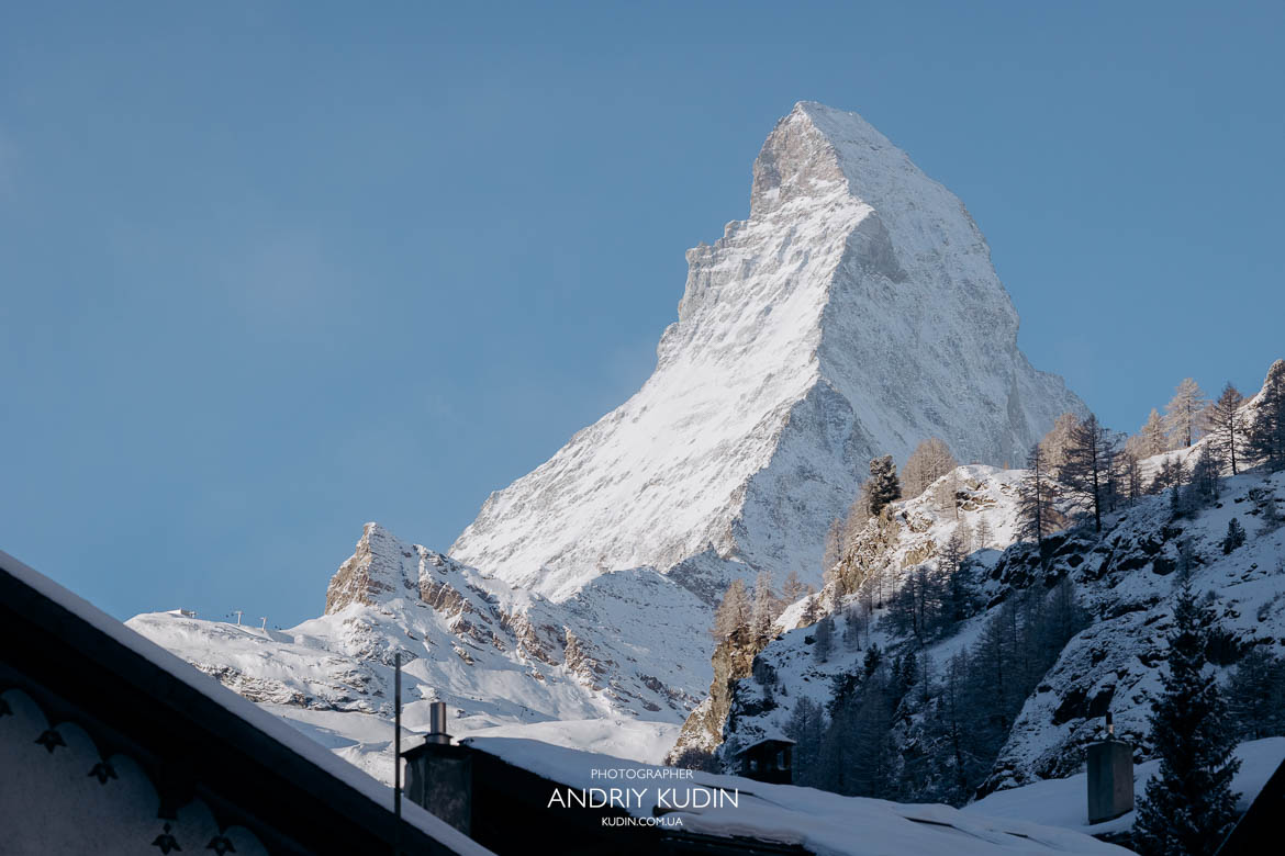 Switzerland proposal photographer taking portraits of a happy couple.