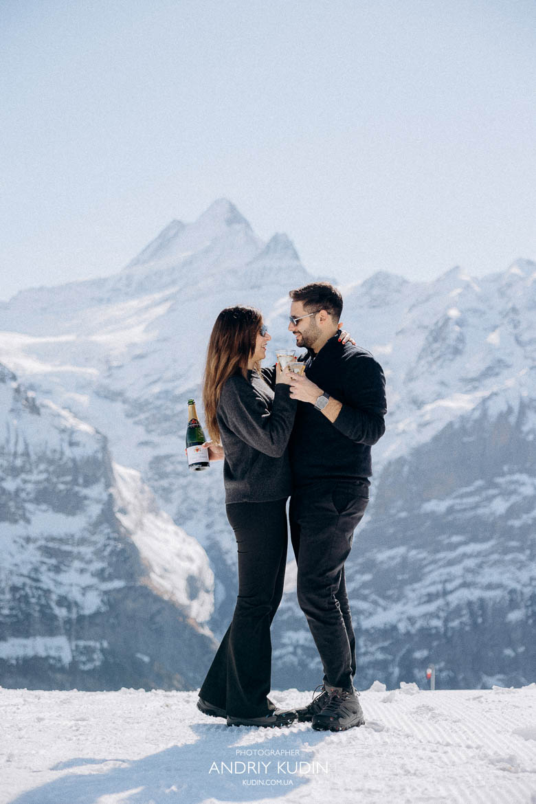 couple hugging mountain view Switzerland, romantic embrace alpine scenery