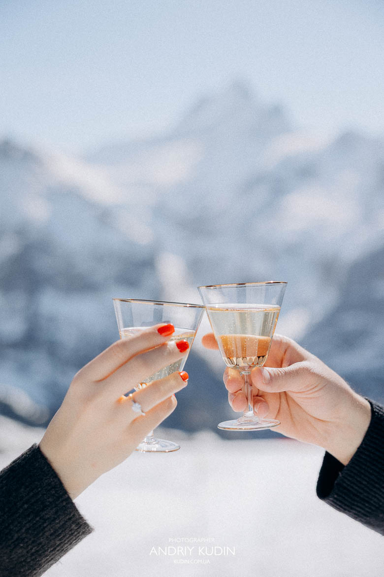 engagement toast mountain view, romantic champagne scene Switzerland