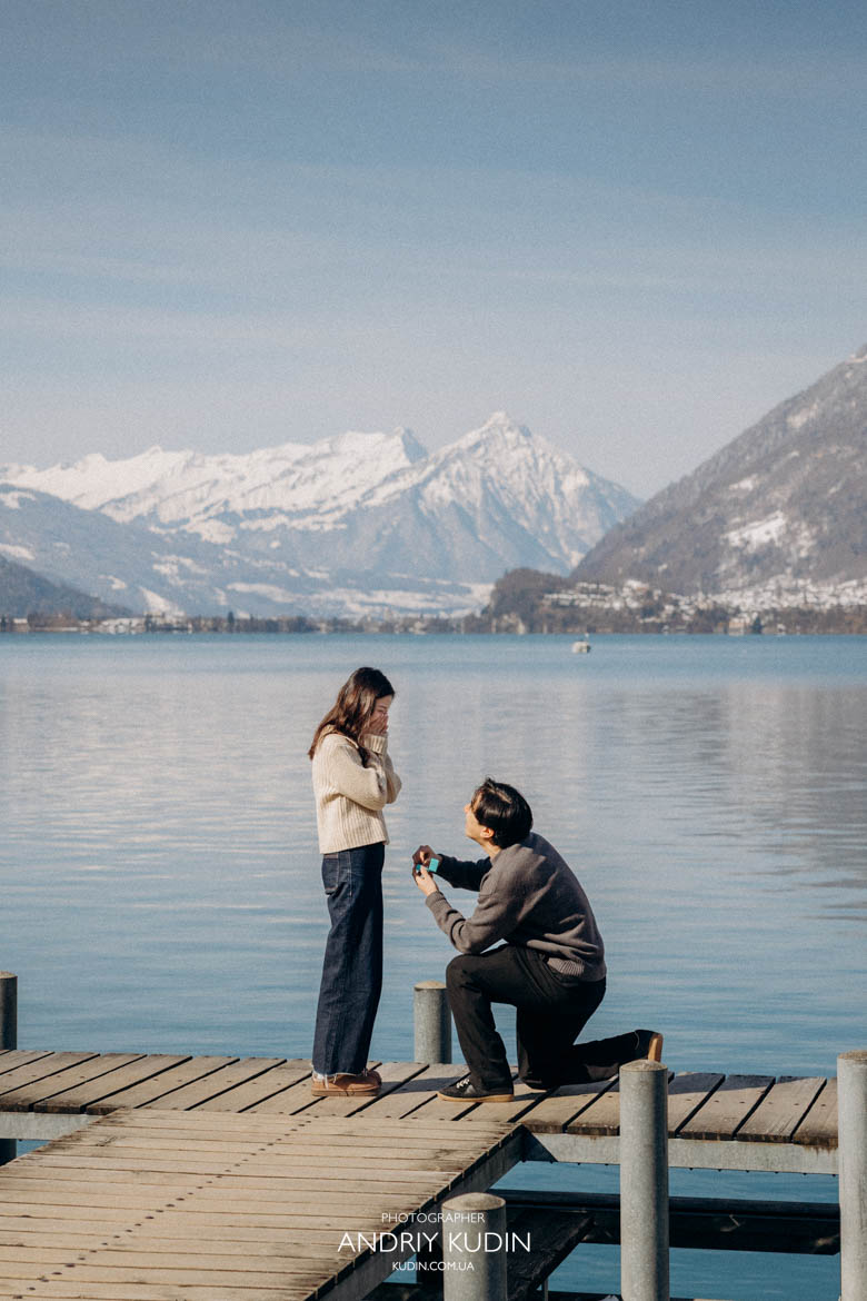 Emotional moment of proposal in Iseltwald with mountain views and engagement in Switzerland