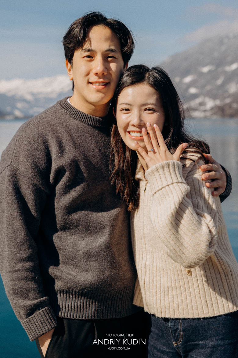 Bride to be surprised during romantic proposal in Iseltwald with Lake Brienz view