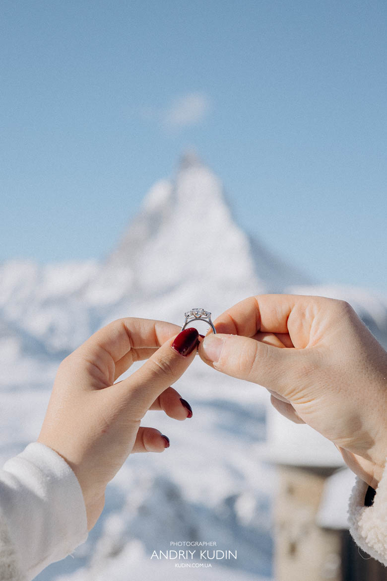 Proposal in zermatt with the bride-to-be showing her ring.