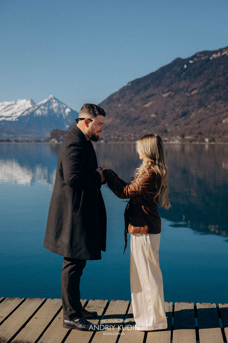 Couple standing on Pier Crash Landing on You in Iseltwald, emotional proposal in Switzerland, 브리엔츠 호수 프로포즈