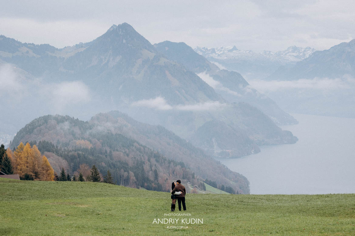 lake lucerne proposal with couple kissing after engagement, switzerland proposal photographer capturing love story