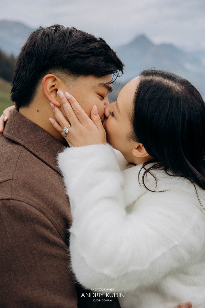 lucerne proposal lakeside engagement with couple hugging tightly, laughing and sharing first kiss after proposal
