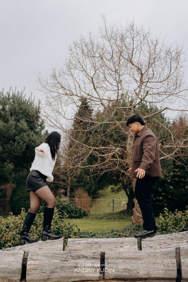 lake lucerne proposal couple walking together after engagement, smiling and laughing, switzerland proposal photographer capturing joy