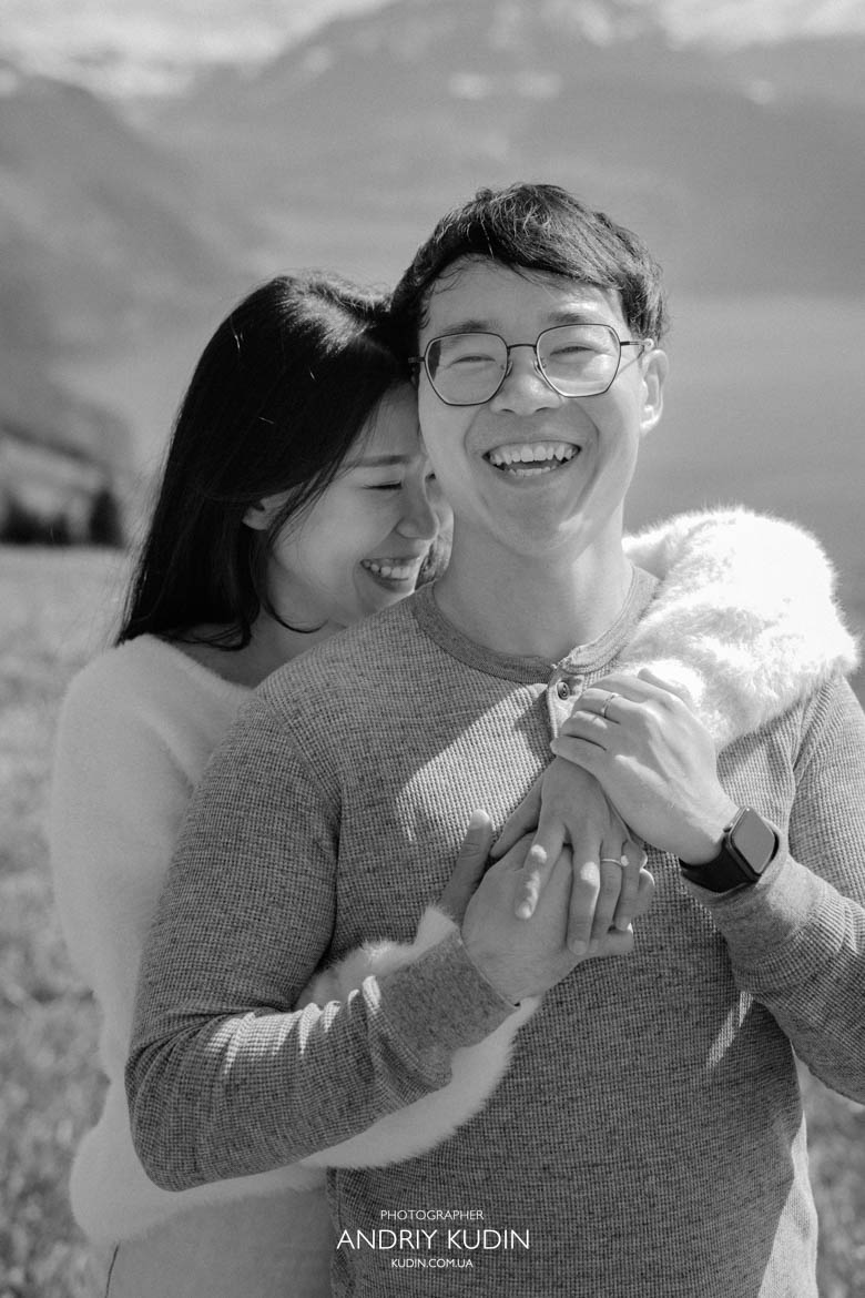 Couple hugging at Villa Honegg with Lake Lucerne view Romantic embrace in Swiss Alps at Villa Honegg