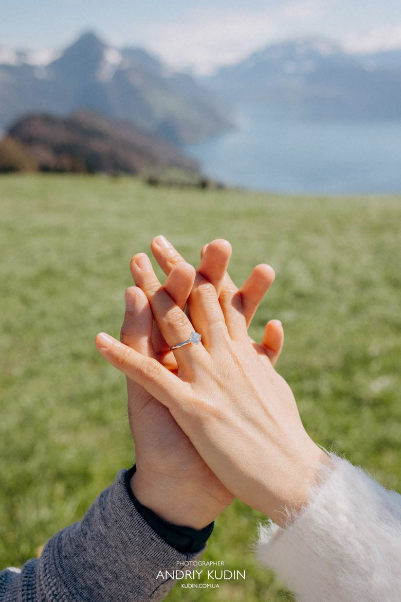 Engagement ring moment with Swiss Alps background