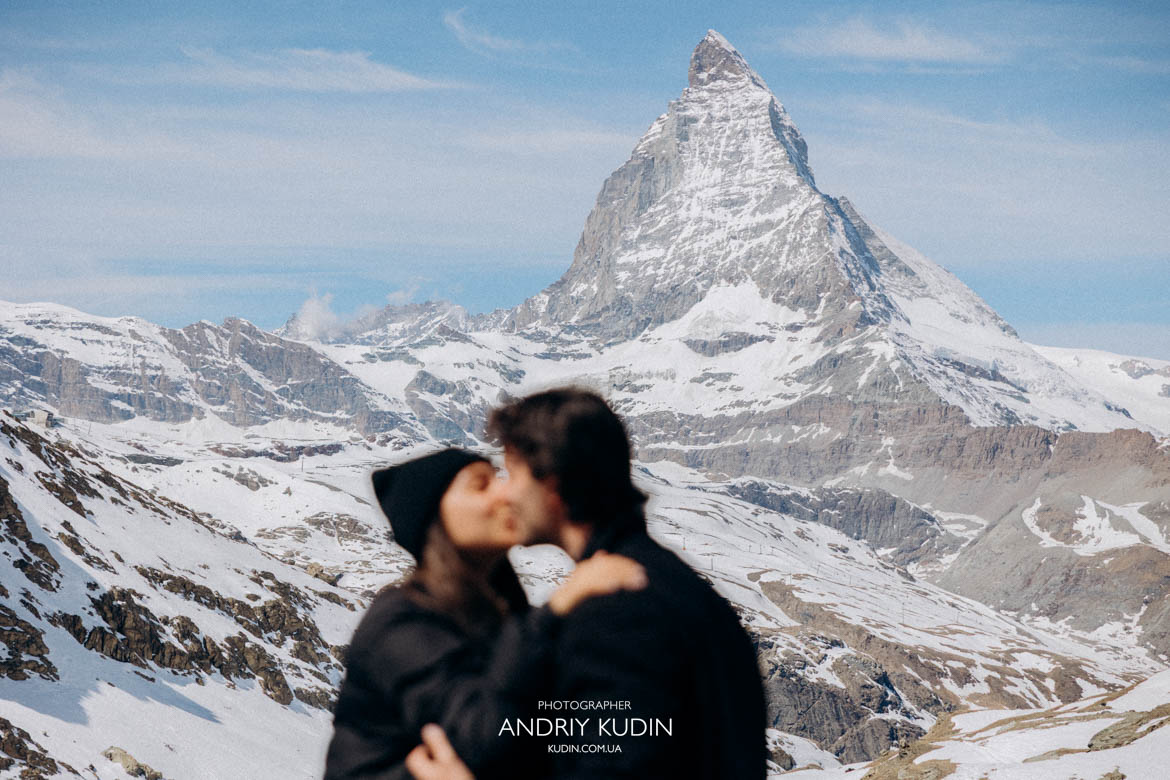 couple hugging after proposal matterhorn, emotional surprise proposal zermatt switzerland