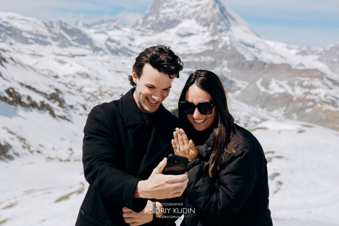 couple smiling proposal matterhorn background