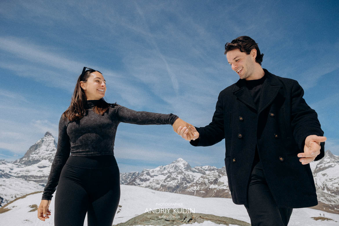engagement switzerland hugging smiling couple