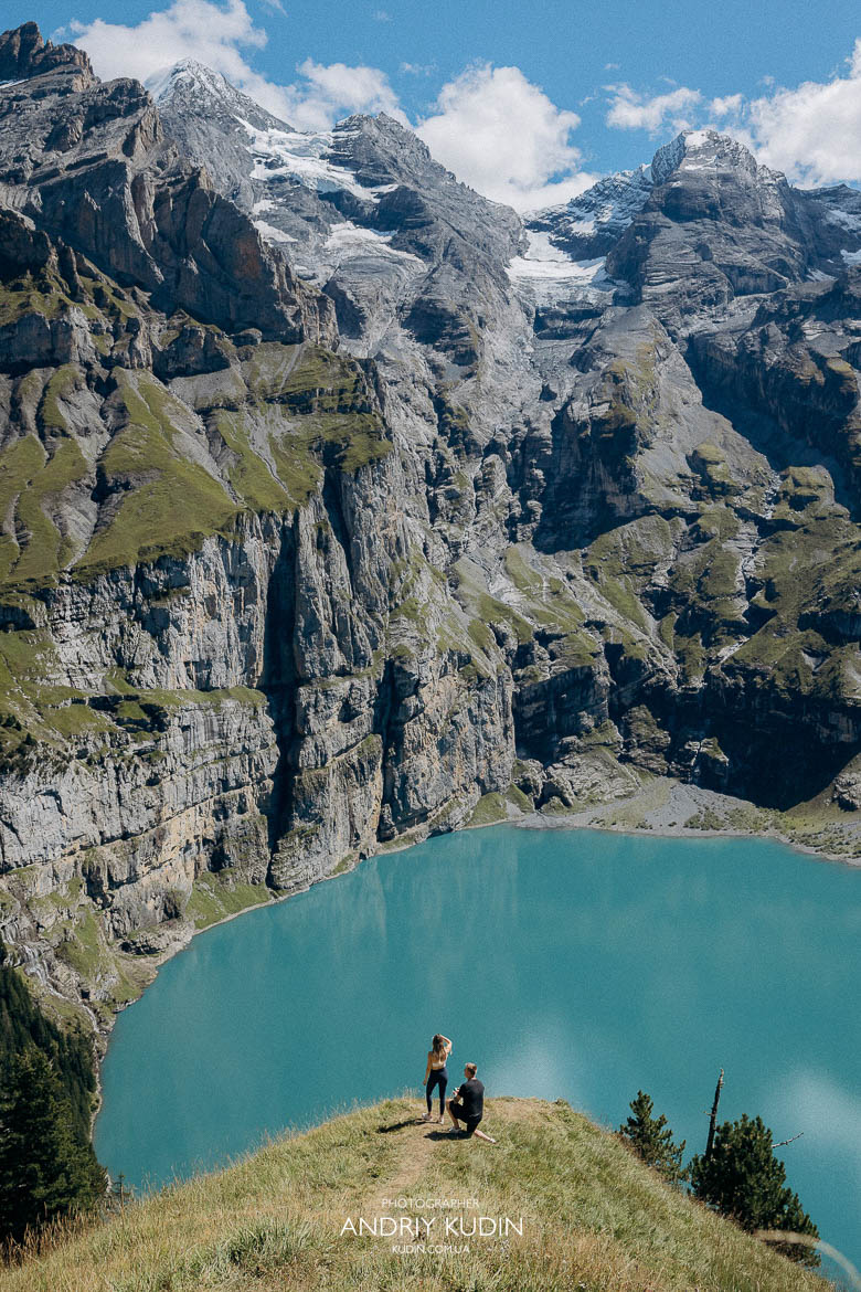 Romantic Lake Oeschinen proposal with mountain view and engagement ring