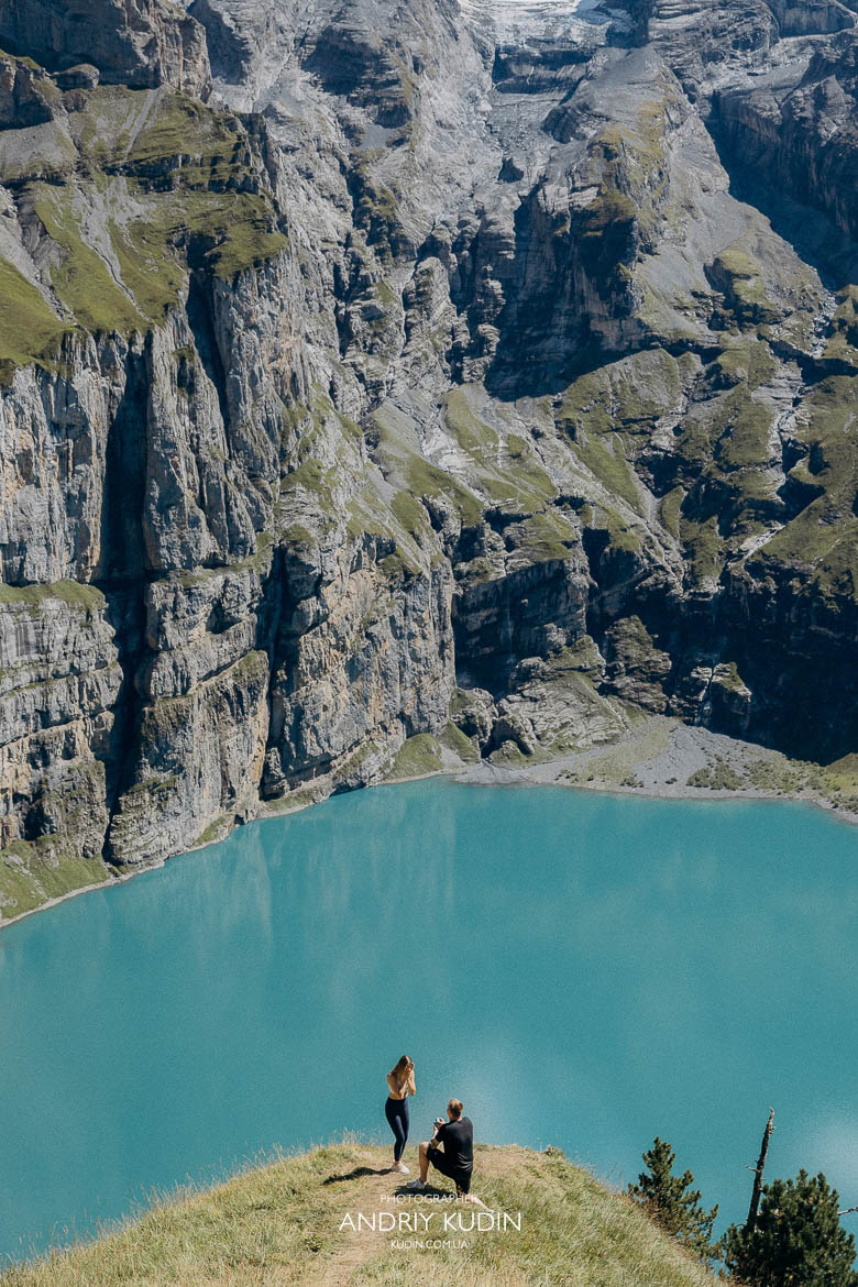 Romantic Lake Oeschinen proposal with mountain view and engagement ring Lake Oeschinensee proposal photographer capturing engagement in Switzerland